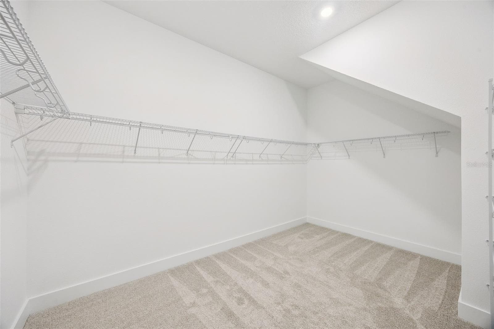 Primary closet - 17428 HONEYBELL TANGELO CT, WINTER GARDEN