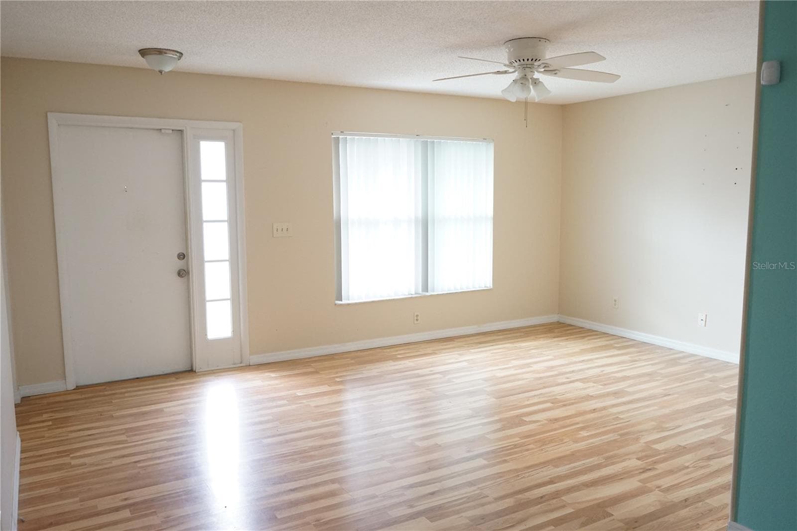 front door and living room - 703 HUXLEY PL, SUN CITY CENTER