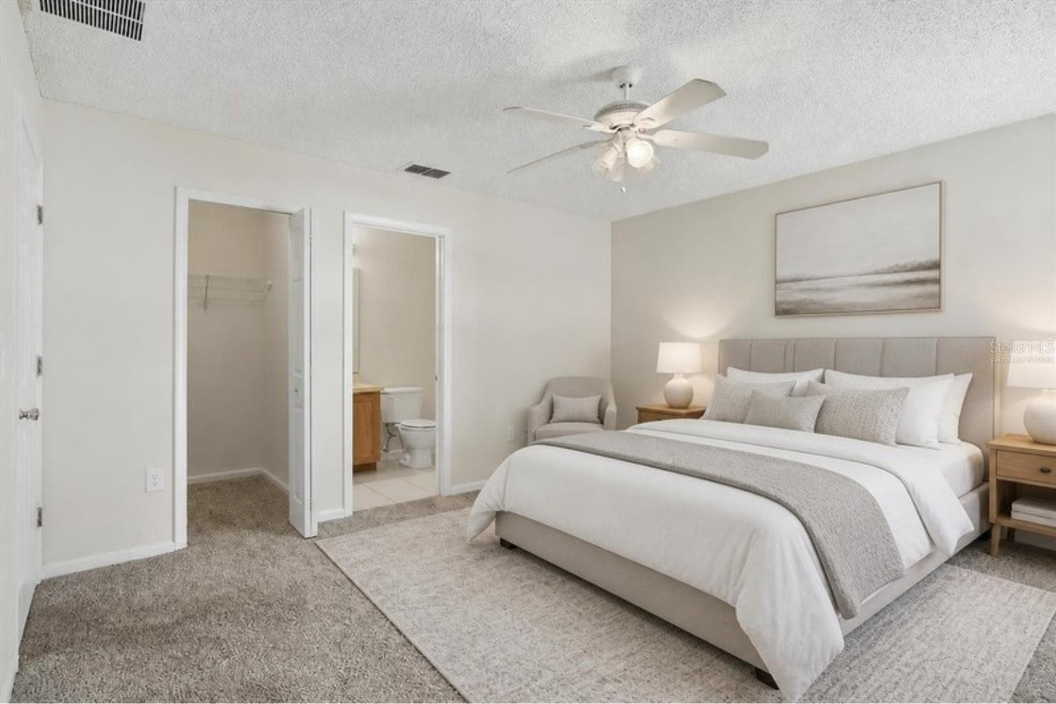 Virtually staged - primary bedroom with walk-in closet and bath - 3 LOUVET LN, PALM COAST