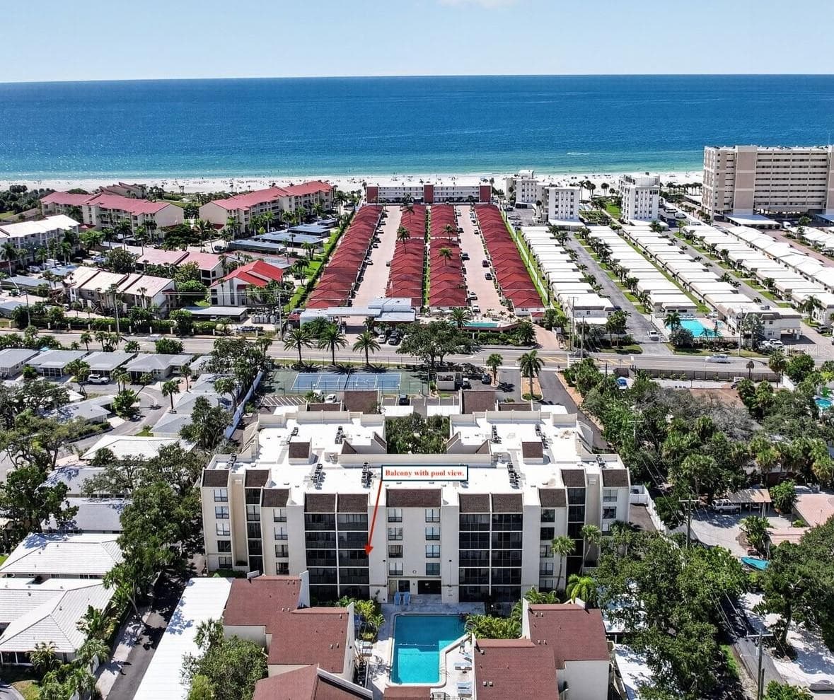 Arrow shows balcony with view overlooking the community pool. - 6157 MIDNIGHT PASS RD #E53, SARASOTA