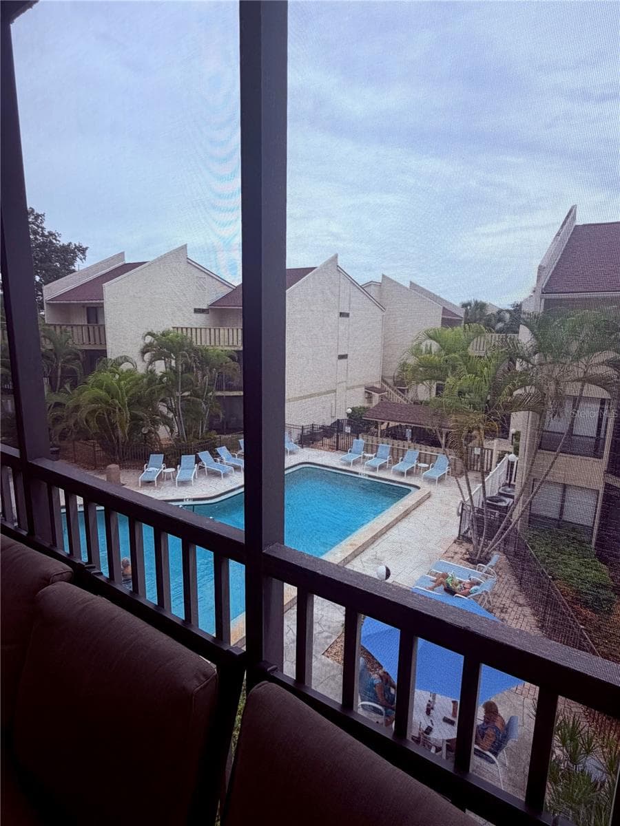 Wonderful view of the pool as seen from the balcony. - 6157 MIDNIGHT PASS RD #E53, SARASOTA