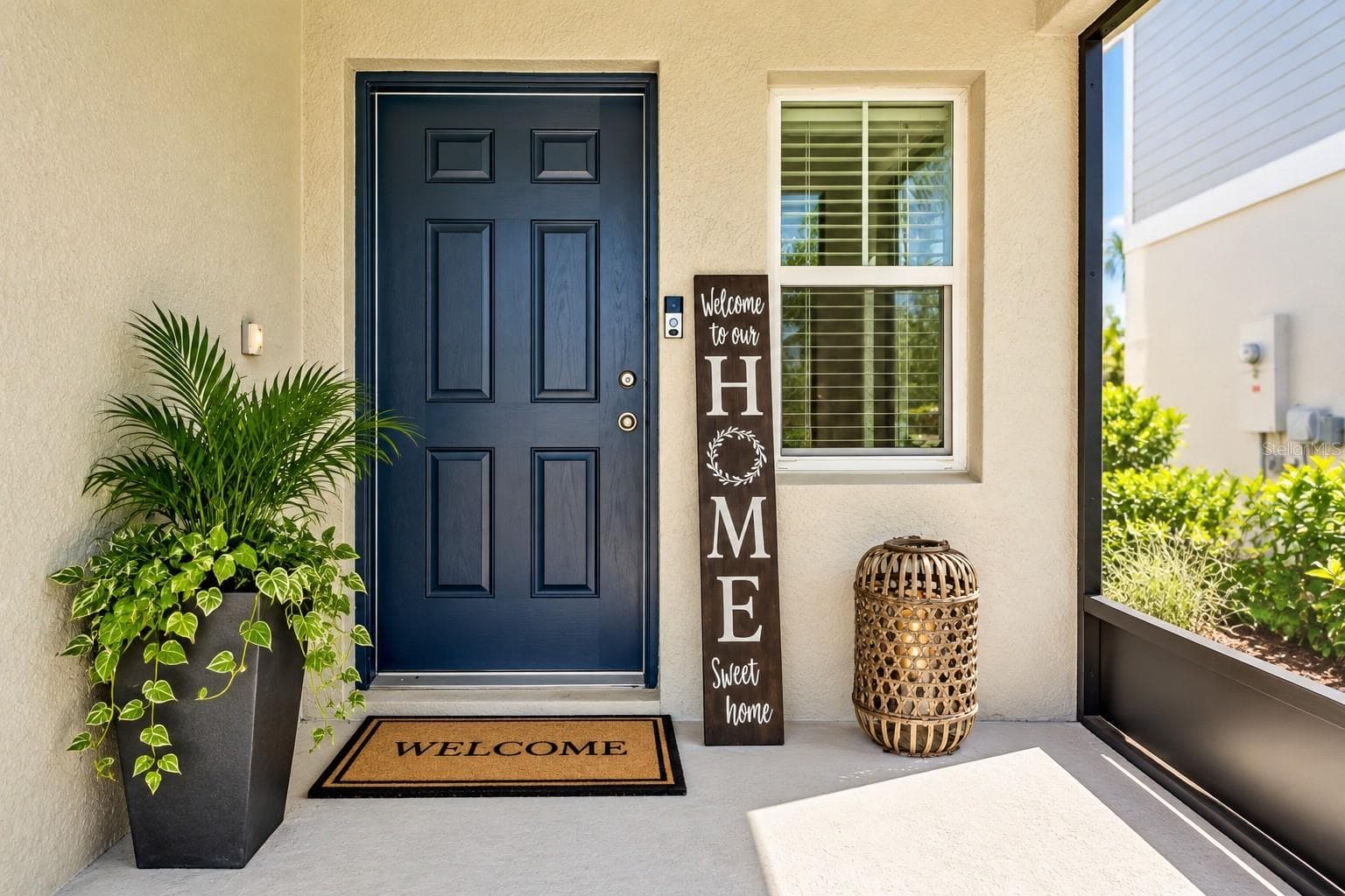 Screened in front porch digitally staged. - 7580 FREESIA TRCE, WESLEY CHAPEL