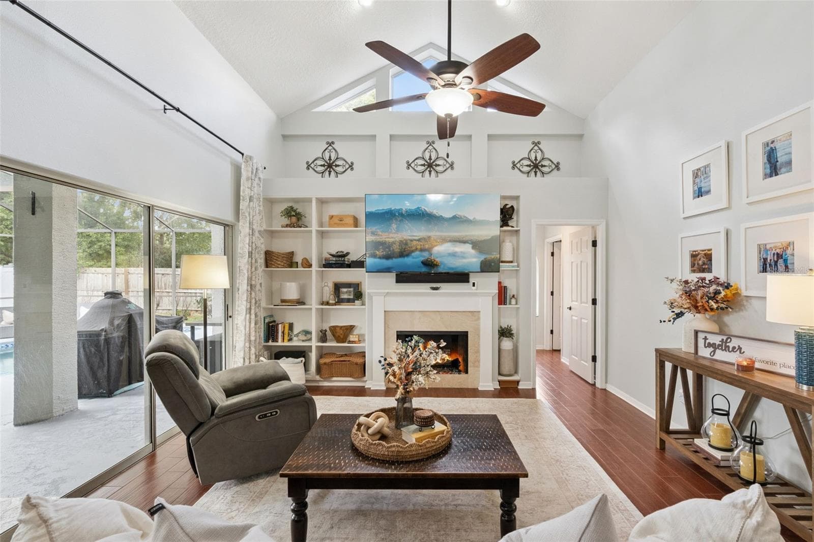 Family Room with Gas Fireplace and Built-In Shelves - 2201 WESTBOURNE DR, OVIEDO