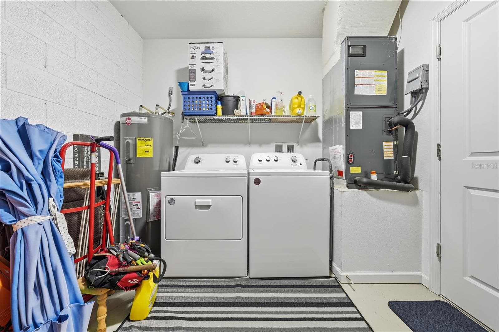 laundry area in garage - 1911 VIRGINIA AVE, EUSTIS
