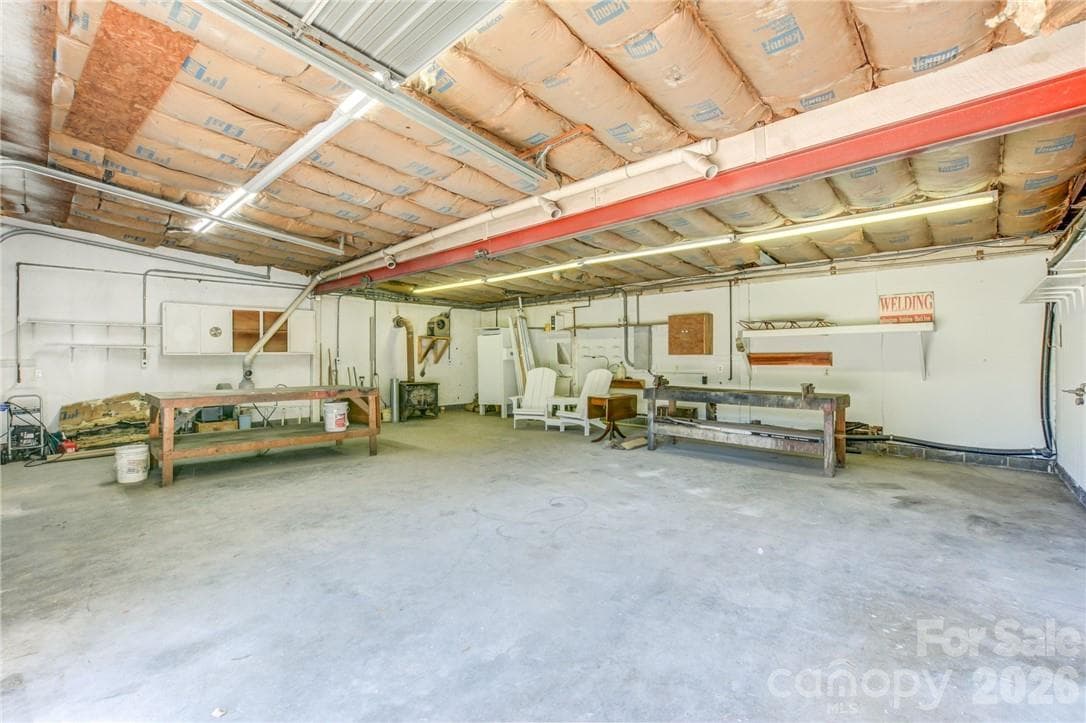 Garage is equipped with bathroom and wood-burning stove - 311 Bell Road, Kings Mountain