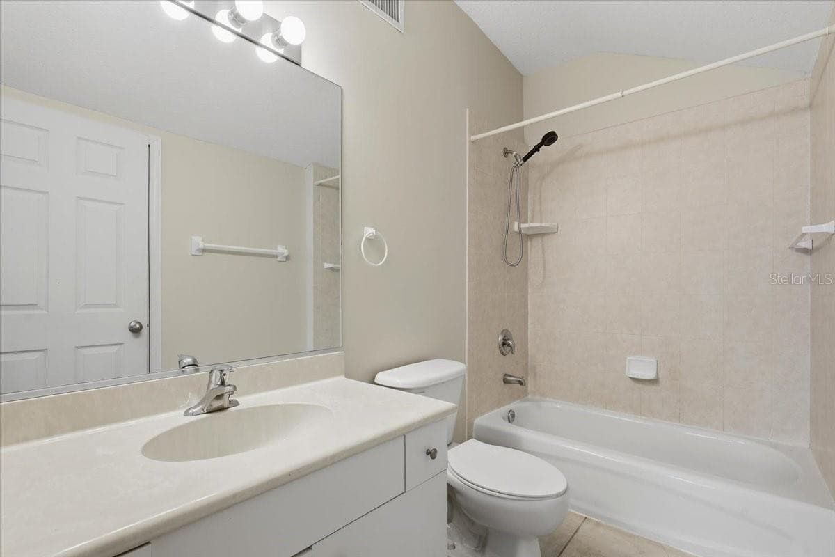 Laundry room with storage - 24 LEAVER DR, PALM COAST