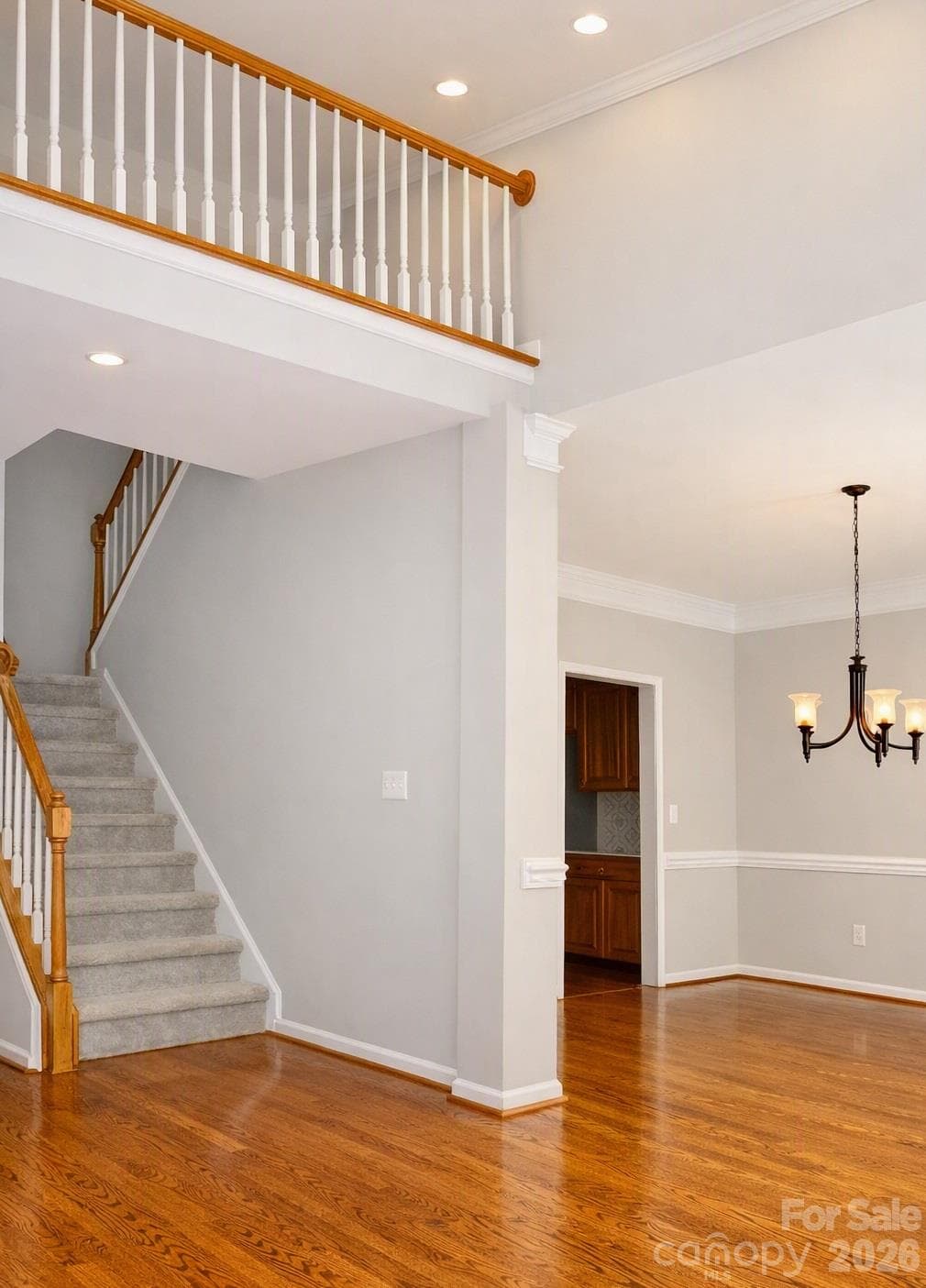 The 2 Story Foyer separates the FL & FDR - 17028 Hampton Trace Road, Huntersville