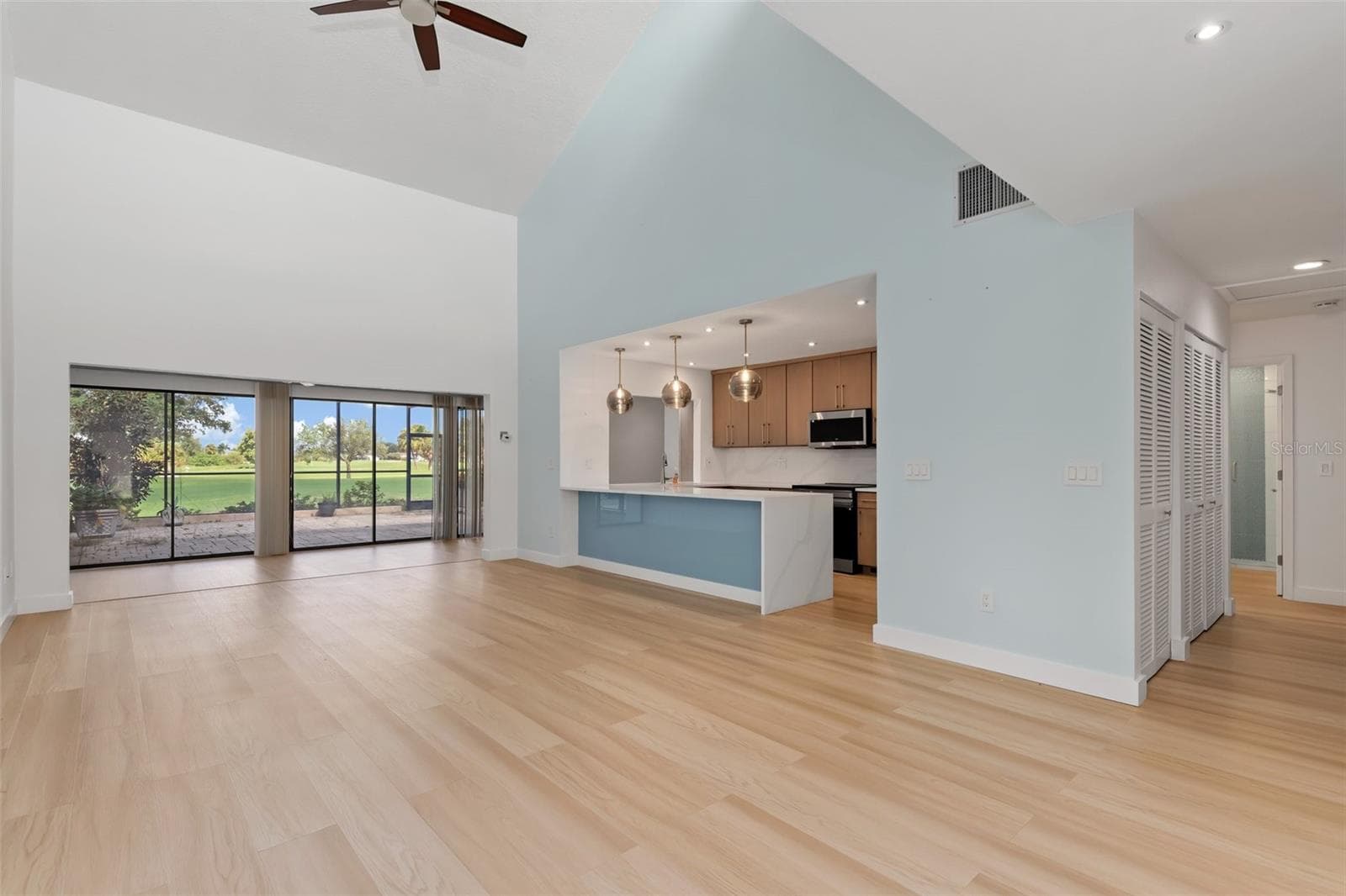 As you enter, Great room with view of golf course - 5021 SAN ROCCO CT, PUNTA GORDA