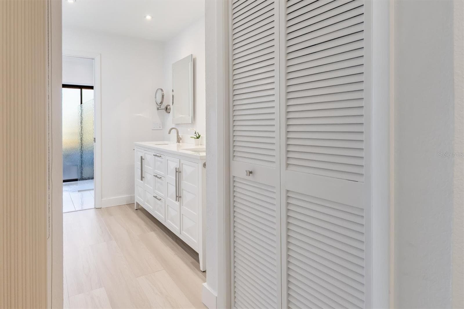 Linen closet and primary bath - 5021 SAN ROCCO CT, PUNTA GORDA