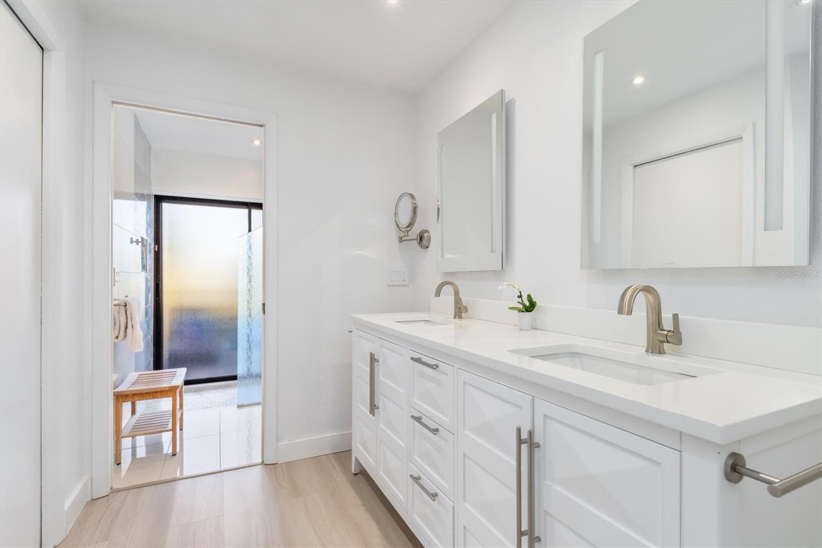 Door to walk in closet on left. Dual sinks on right. - 5021 SAN ROCCO CT, PUNTA GORDA