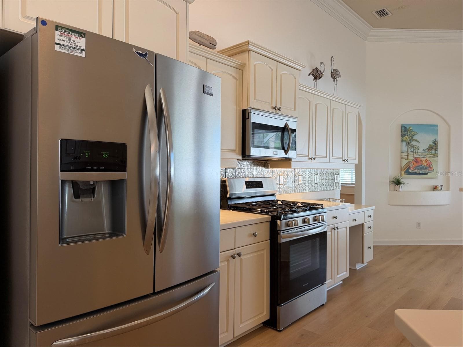 Large Refrigerator with two doors and a freezer drawer - 2311 OASIS DR, LAND O LAKES
