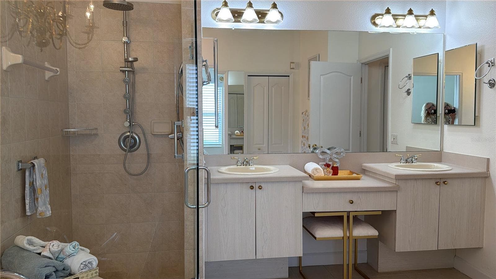 Shower has built in seat, and multiple shower heads and jets - 2311 OASIS DR, LAND O LAKES