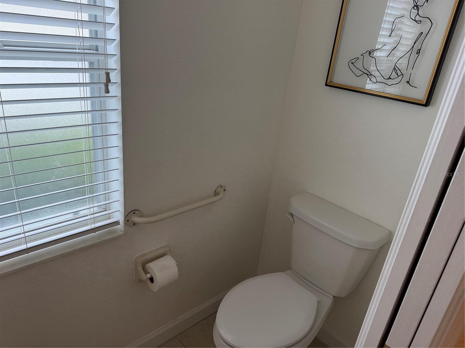 private water closet with pocket door - 2311 OASIS DR, LAND O LAKES