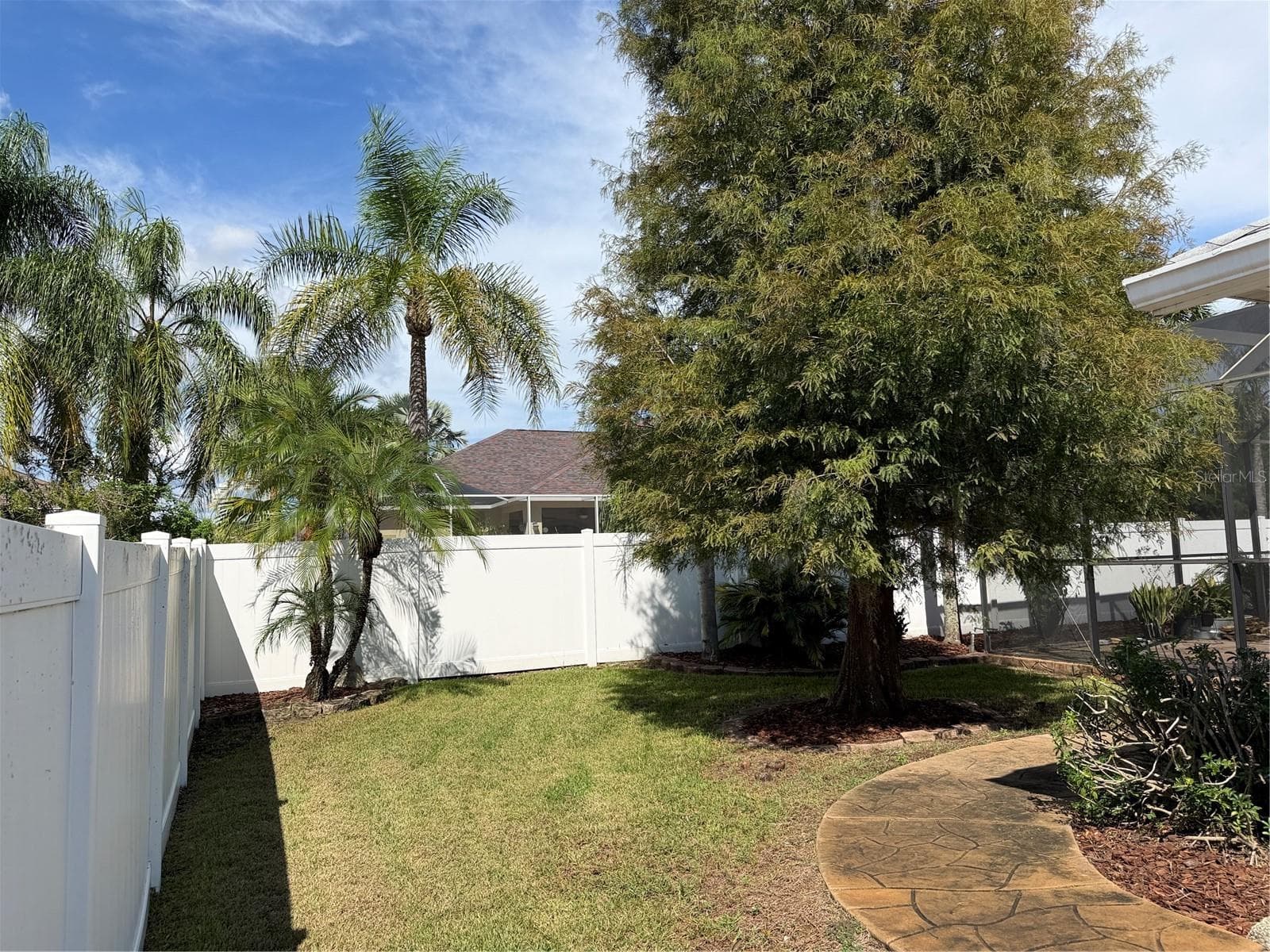 Beyond the privacy fence is access to the common area, clubhouse and community pool - 2311 OASIS DR, LAND O LAKES