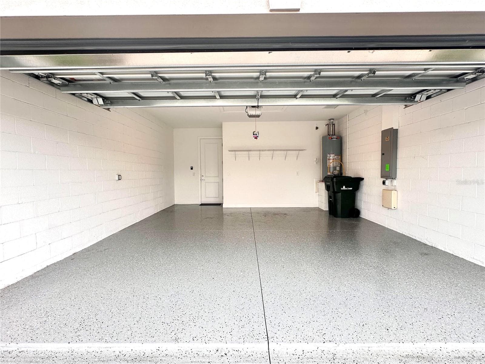2-car garage with EV charger - 14229 EAGLE BRANCH DR, NOKOMIS
