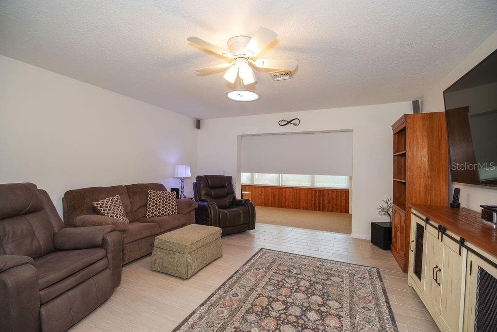 Living Room with shade divider - 290 PARADISE BLVD #17, MELBOURNE
