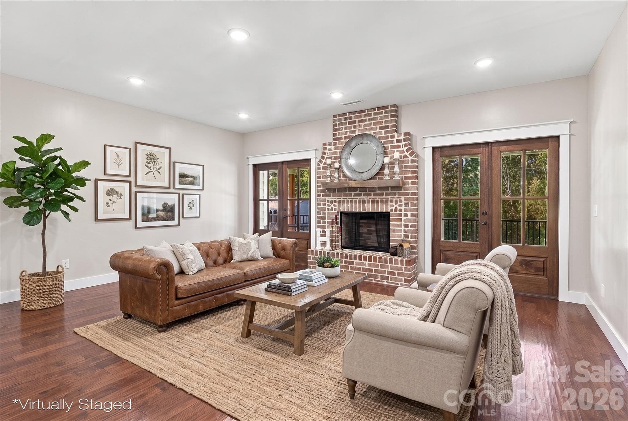Virtually staged Living room with french doors flanking the beautiful brick fireplace! - 3098 Irene Bridge Highway, Hickory Grove
