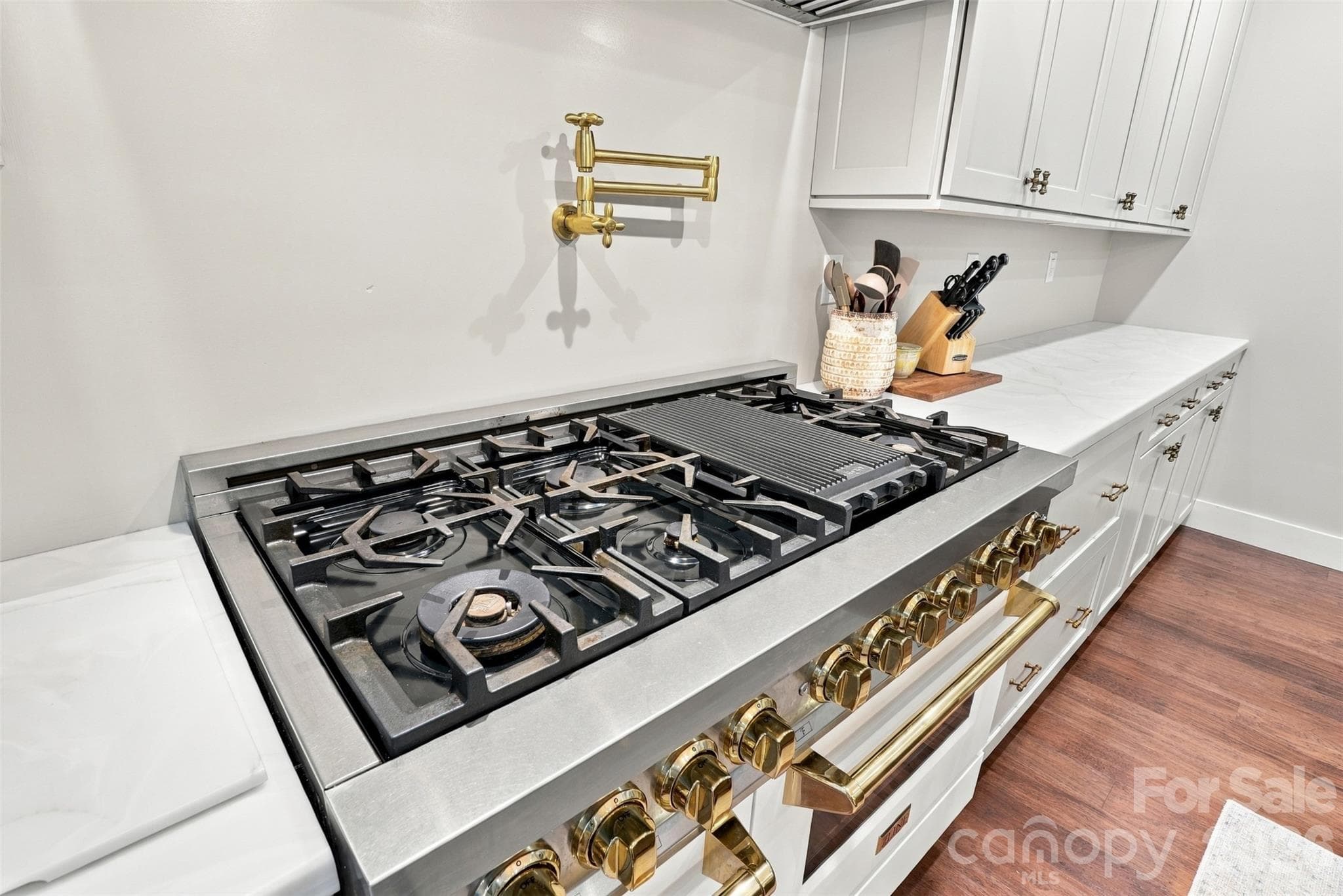 Beautiful gold colored knobs/handles on this Z-line Double oven and gas range with griddle and pot filler - 3098 Irene Bridge Highway, Hickory Grove