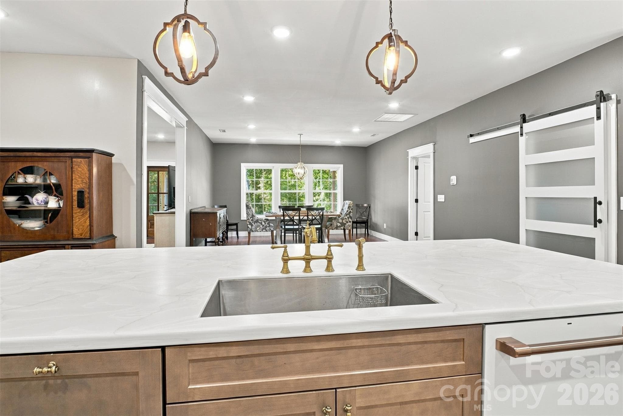 Stainless Steel single in large kitchen island overlooks the dining area. Walk-in pantry is to the right behind the barn door - 3098 Irene Bridge Highway, Hickory Grove