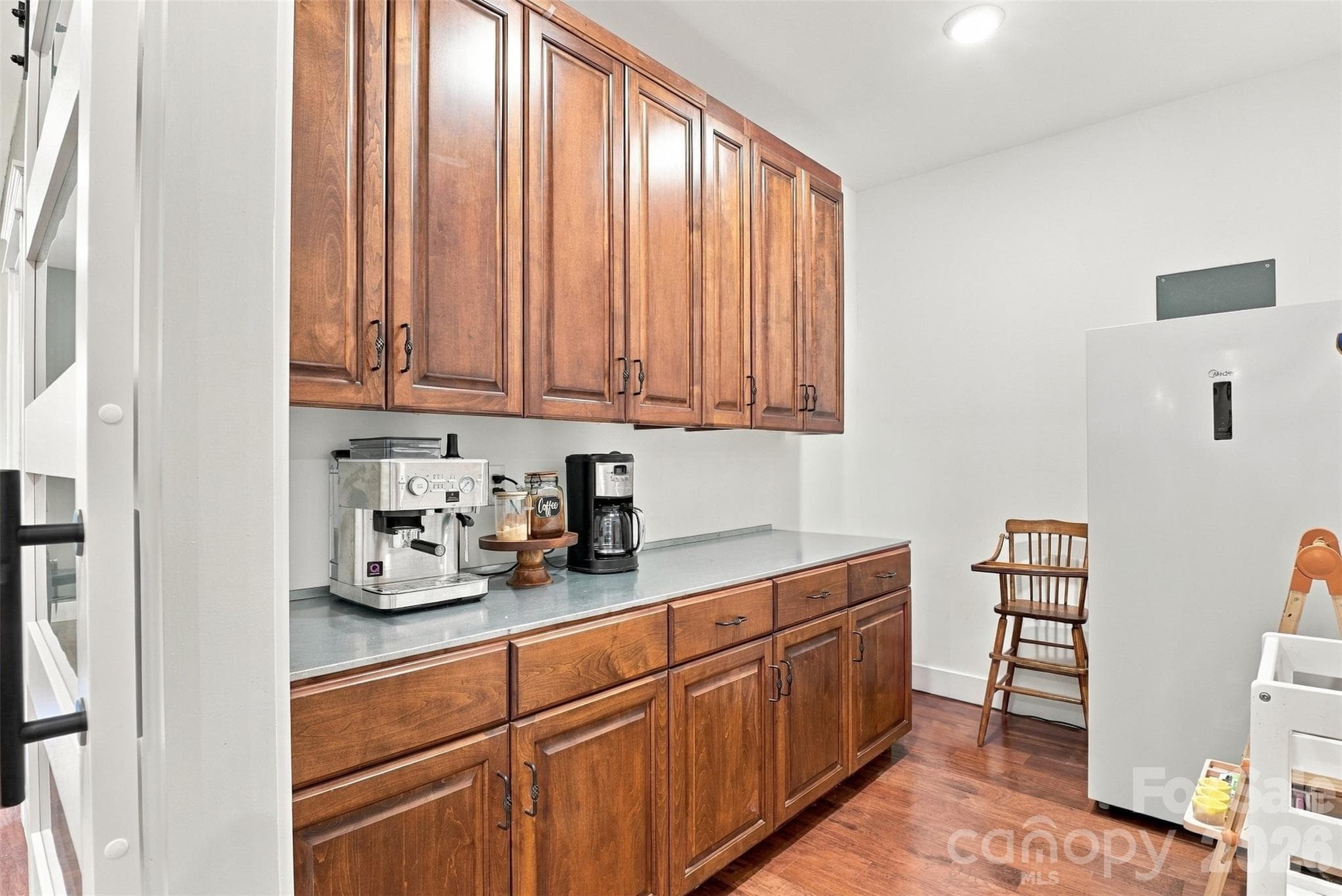 Butler's pantry with lots of storage behind a beautiful sliding barn door off the kitchen - 3098 Irene Bridge Highway, Hickory Grove