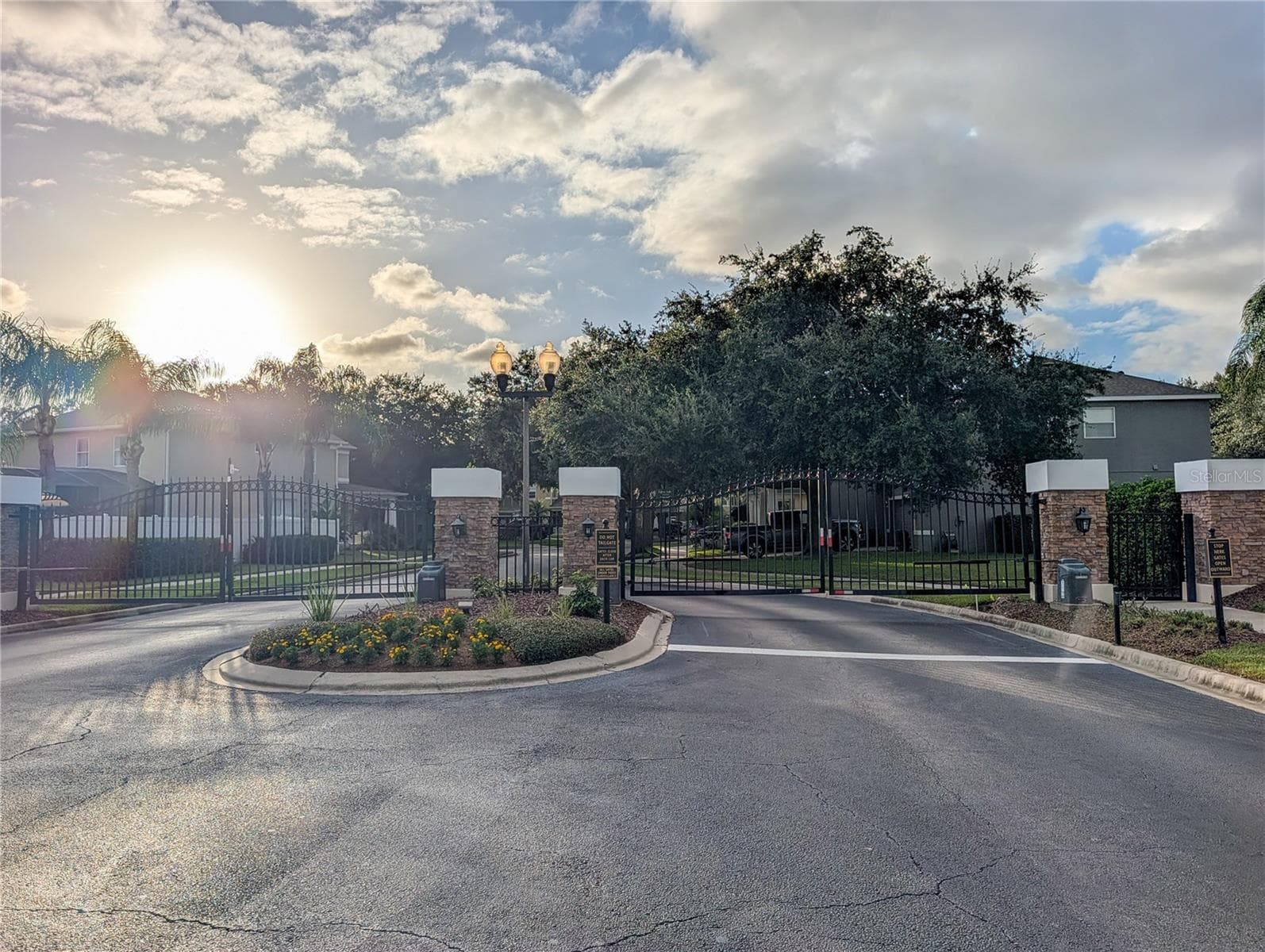 gated entrance to neighborhood - 14038 EDEN ISLE BLVD, WINDERMERE