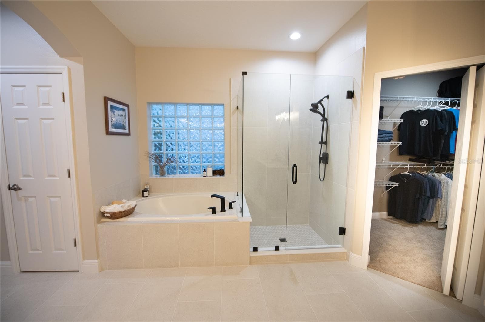 primary bathroom with new tile & shower & duel vanities - 14038 EDEN ISLE BLVD, WINDERMERE