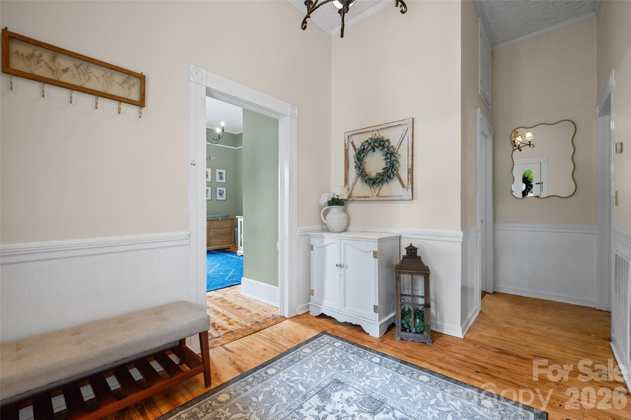 Another view highlighting the home's inviting entryway,  hardwoods, and timeless details. - 231 E Jefferson Street, York