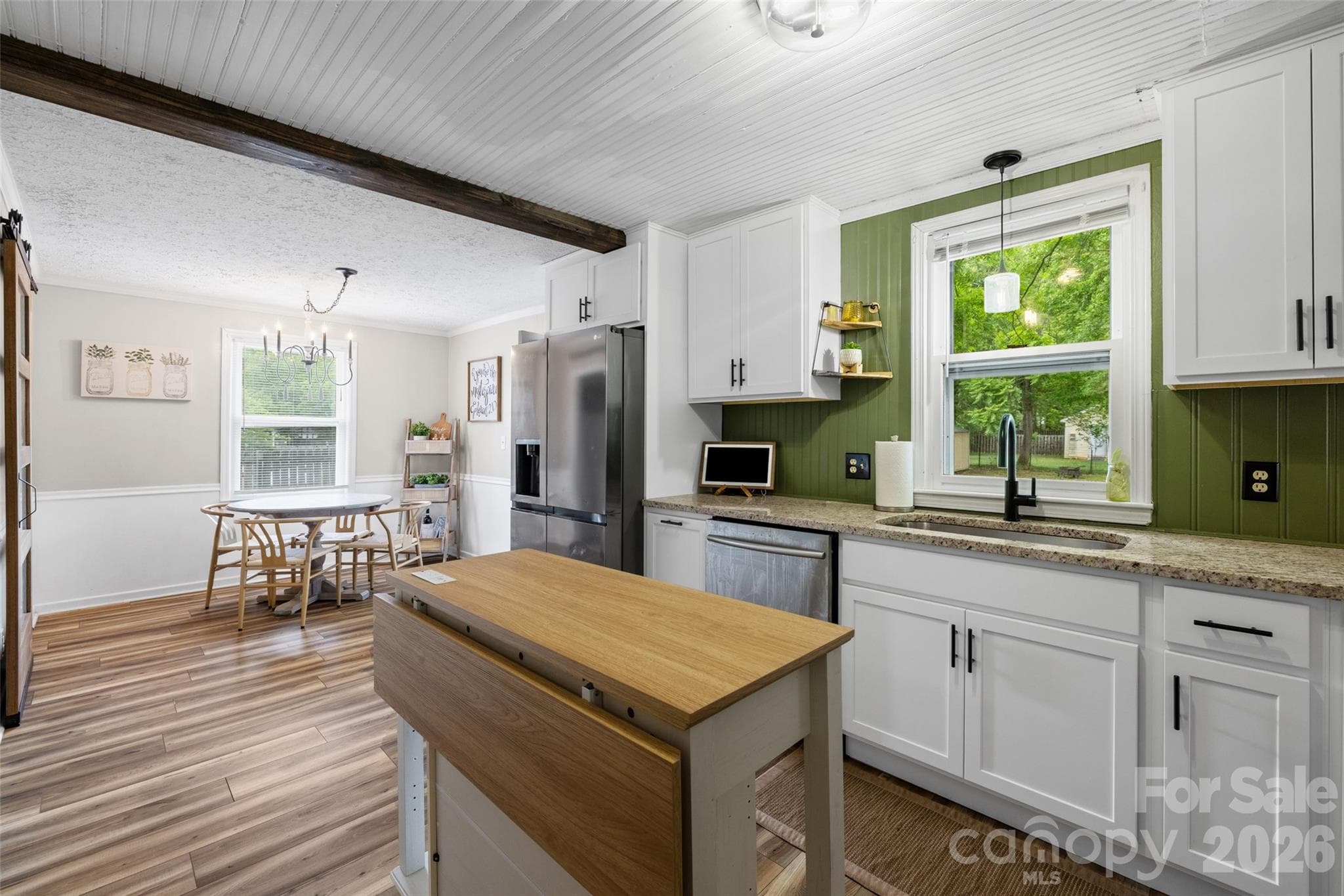 Bright and inviting kitchen with updated finishes, and charming exposed ceiling beams. - 231 E Jefferson Street, York