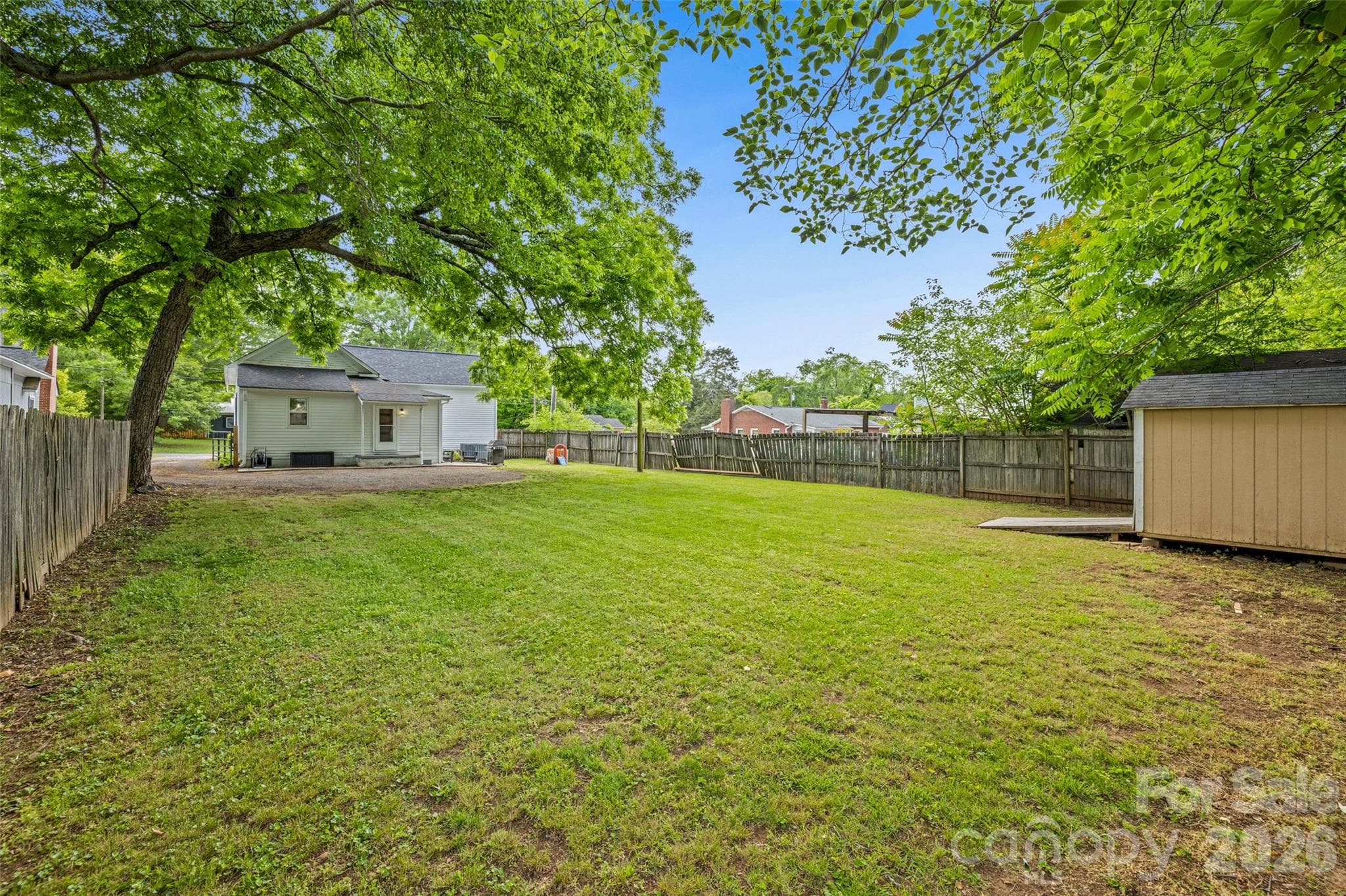 Expansive fenced backyard with mature shade trees and plenty of space for gardening, recreation, or entertaining. - 231 E Jefferson Street, York