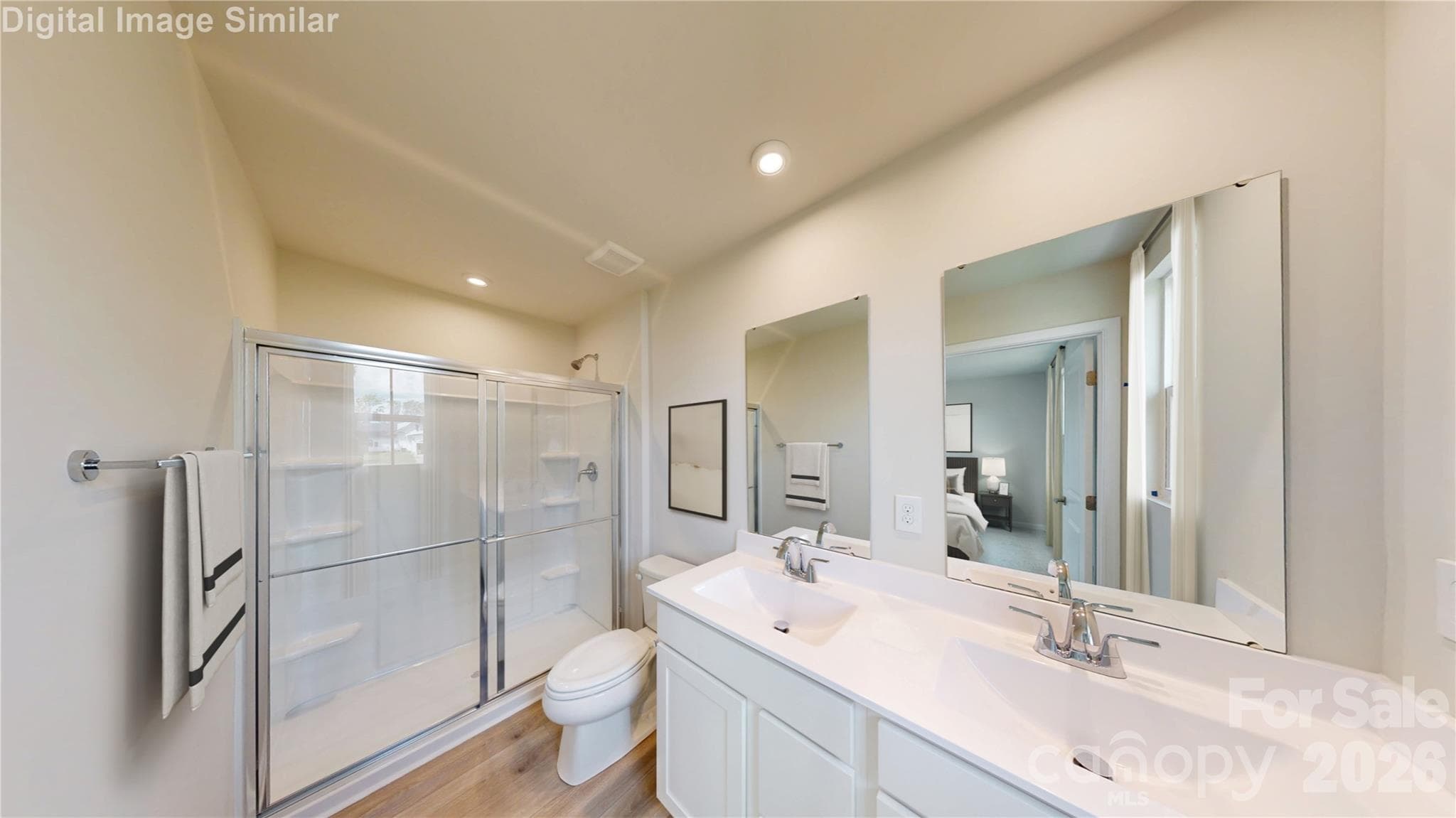 Steam, style, and space! This luxurious primary bath features a spa-worthy shower and dual vanities — perfect for mornings that start with calm and end with glam! - 10012 Florentine Way, Charlotte