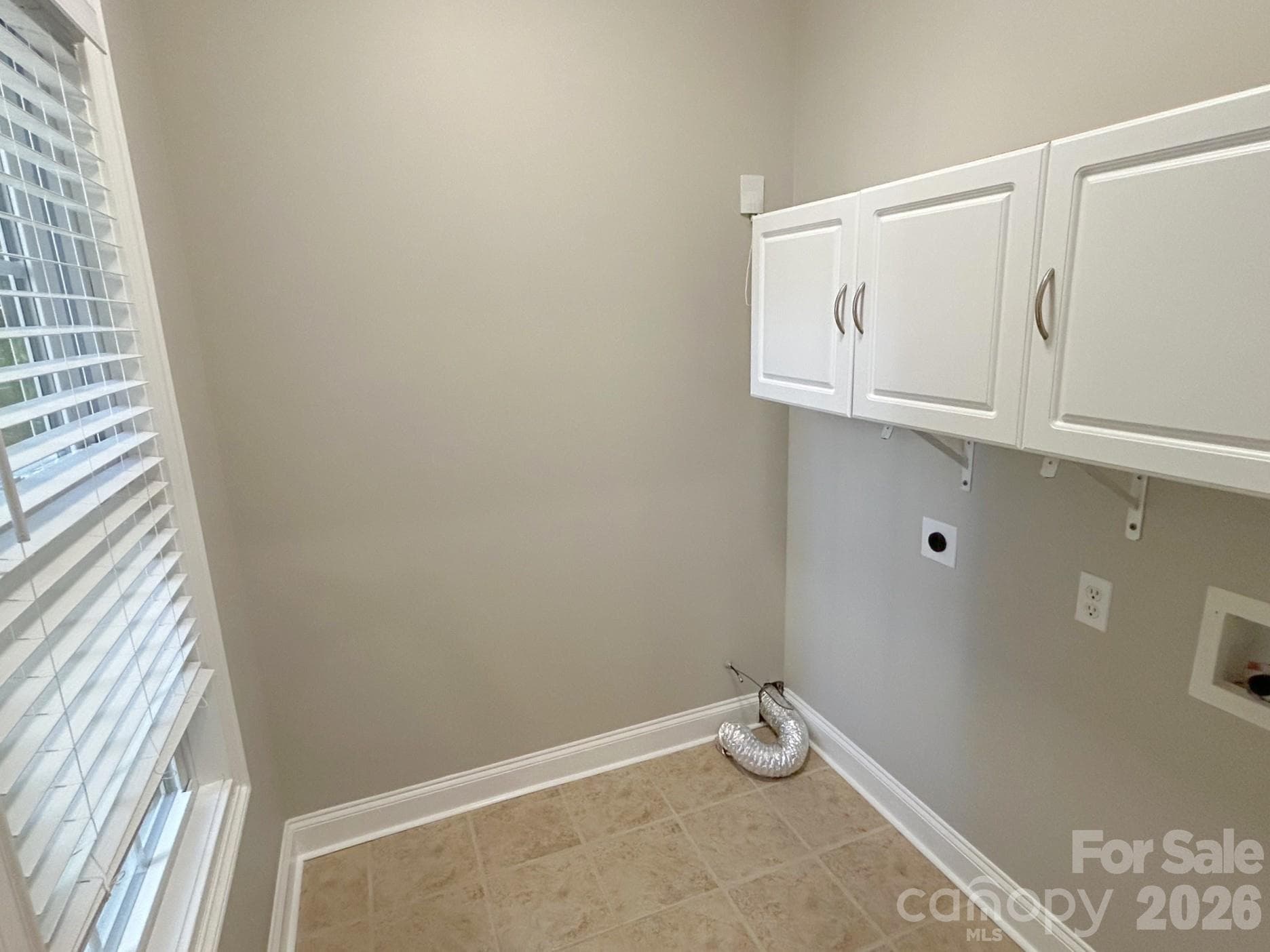 Laundry room on main level off kitchen - 201 Colonel Holcombe Place, Candler