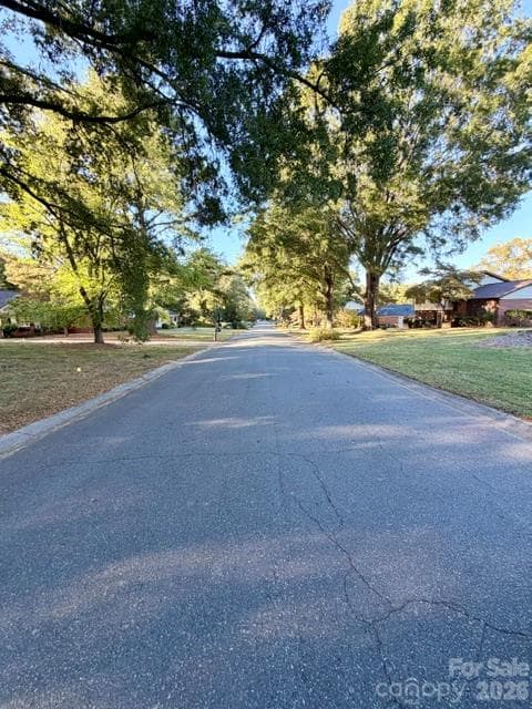 Street view from neighborhood entrance - 13519 Four Oaks Lane, Matthews