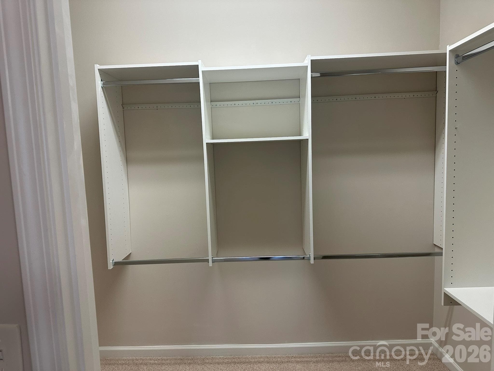 Spacious walk in Primary closet with new shelving - 2047 Sweetleaf Drive, Indian Land
