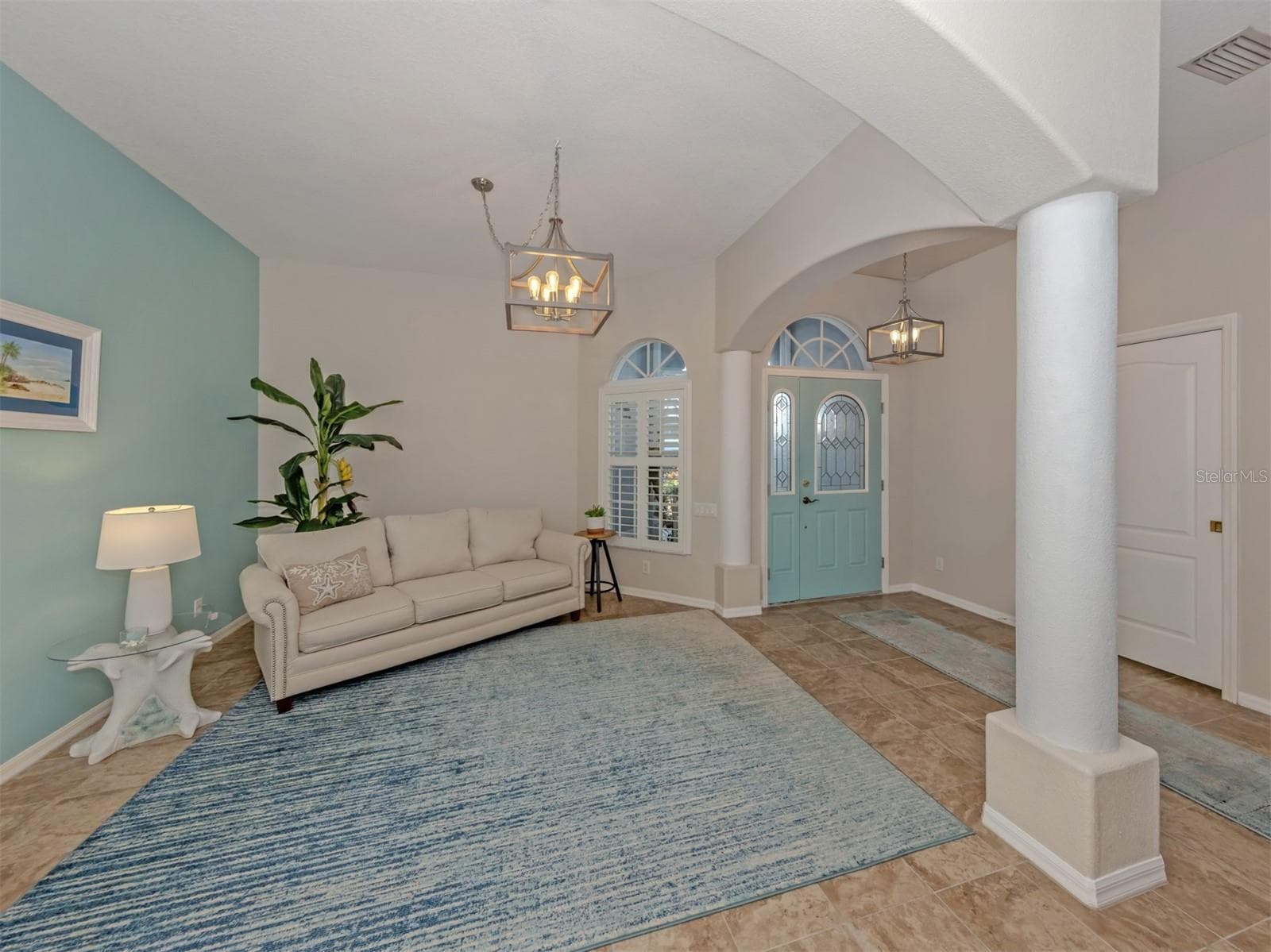 This versatile dining area has been thoughtfully transformed into a cozy sitting room, perfect for reading, relaxing, or simply unwinding. Beautiful plantation shutters and adjustable dimmable lighting add warmth and charm, while the space can easily return to a lovely dining area! - 443 BERMUDA ISLES CIR, VENICE