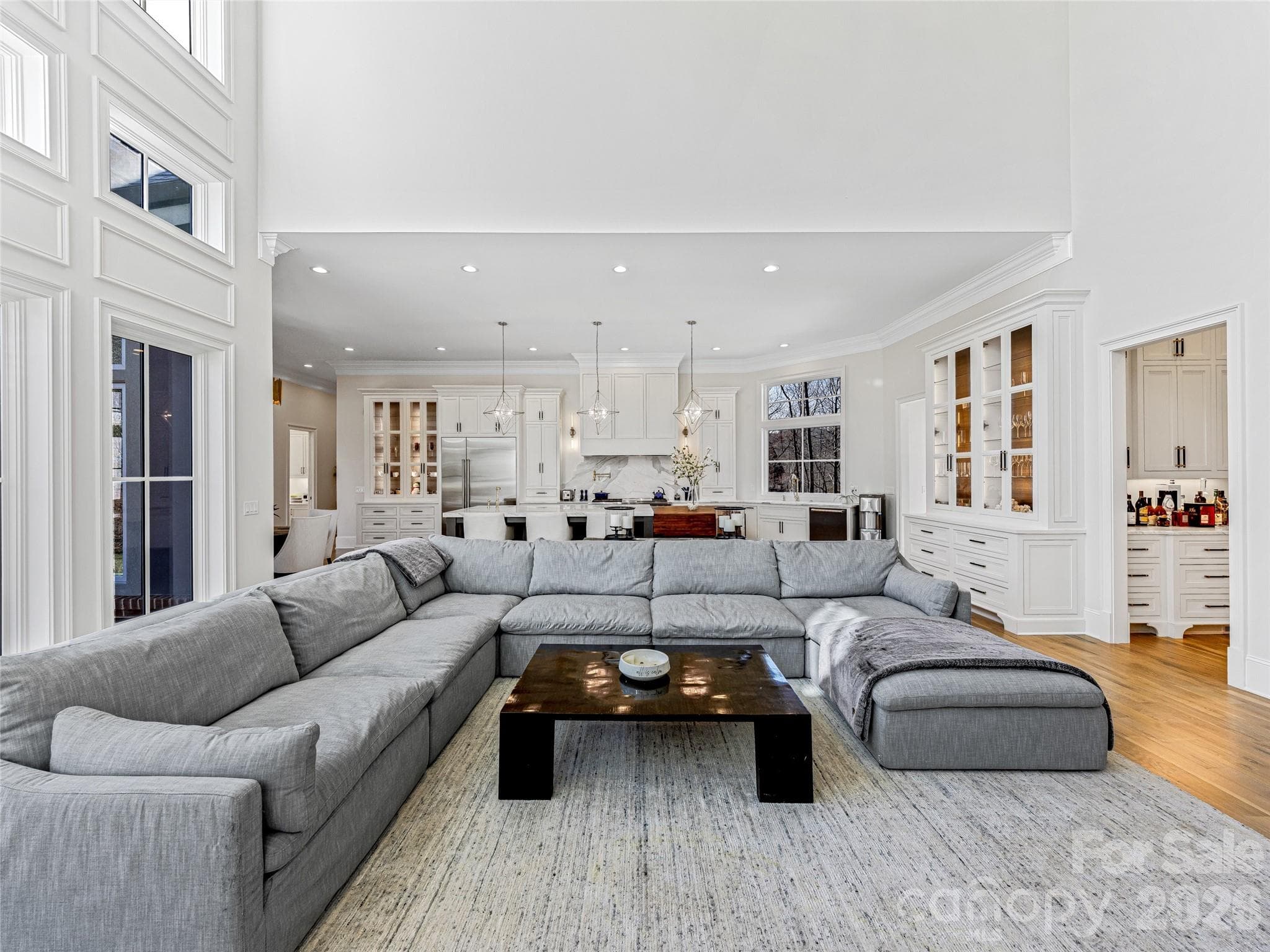 View from in front of fireplace in great room looking towards kitchen. - 1905 White Tree Trail, Arden