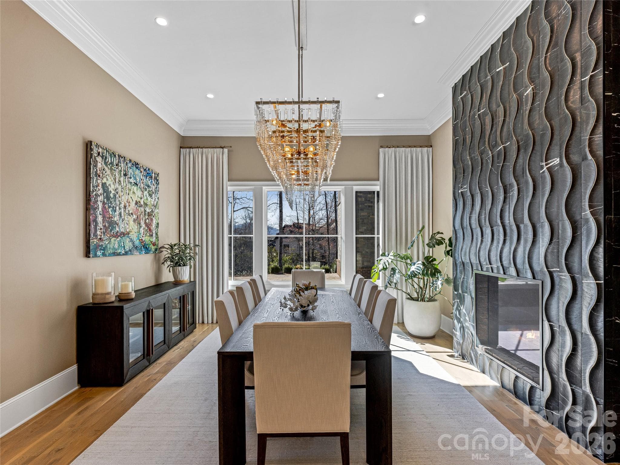 Dining Room with custom chandelier & see through fireplace - 1905 White Tree Trail, Arden
