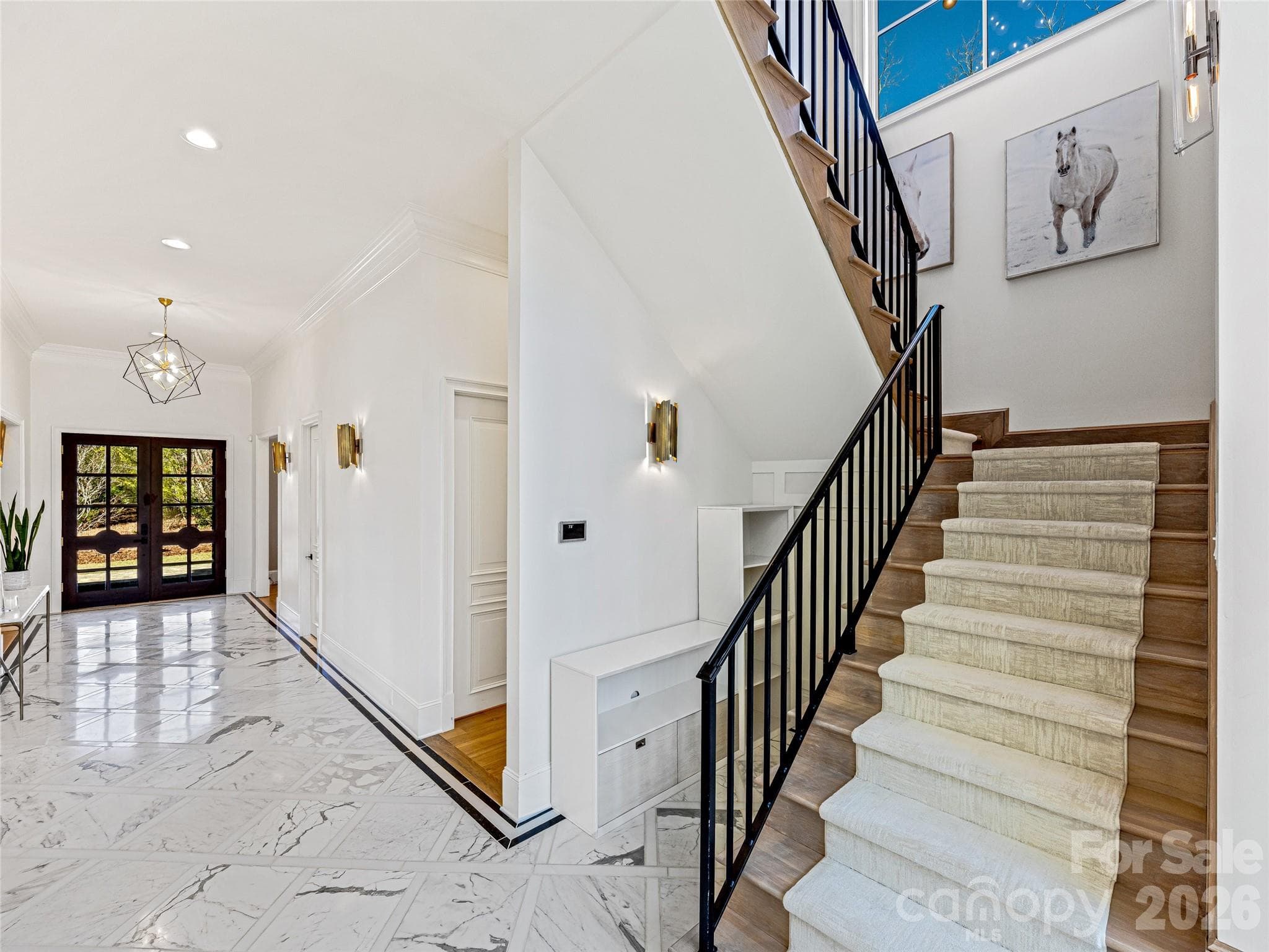 Custom entryway and staircase leading to upstairs living area. - 1905 White Tree Trail, Arden