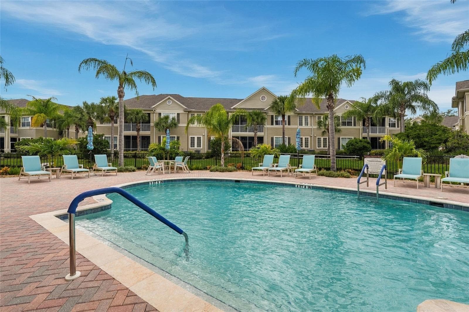 Community pool with plenty of seating - 7946 TYBEE CT, UNIVERSITY PARK