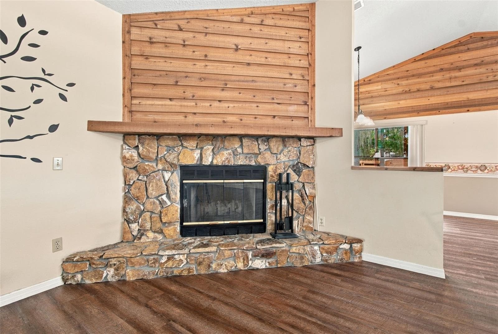 CEDAR TRIM OVER STONE FIREPLACE WITH BLOWER - 3180 LAKE SAXON DR, LAND O LAKES