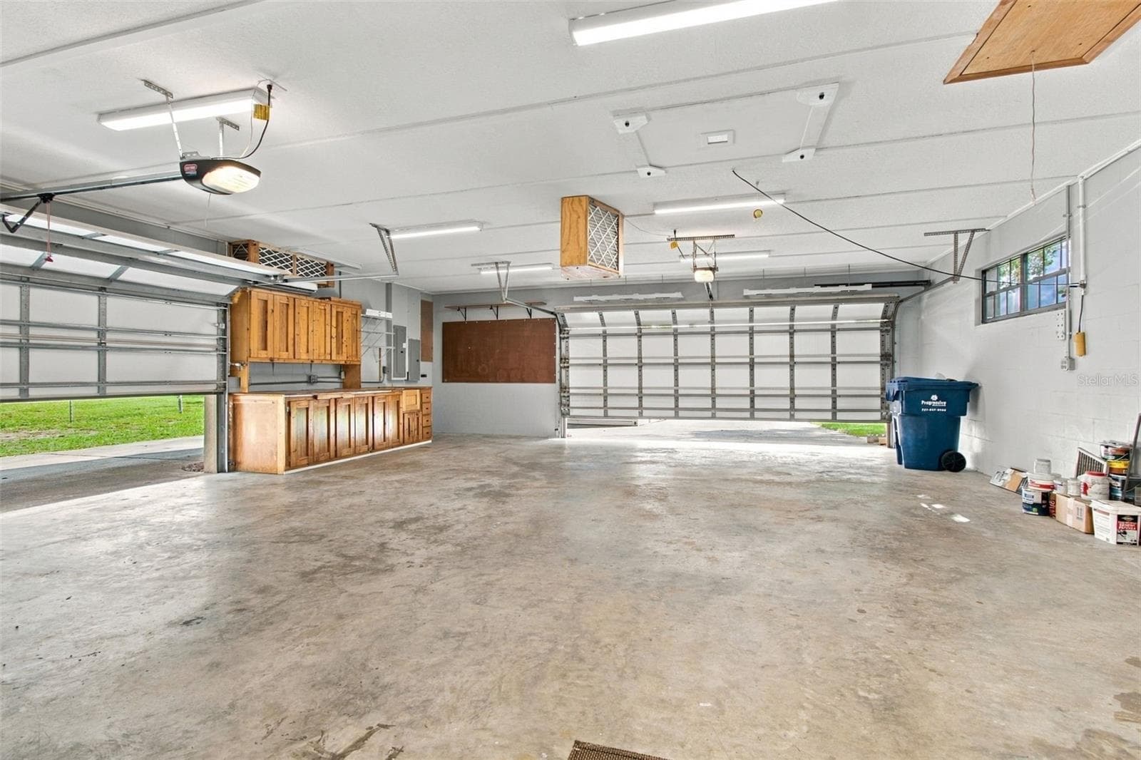 2 OVERHEAD GARAGE DOORS TO 4 CAR GARAGE - 3180 LAKE SAXON DR, LAND O LAKES