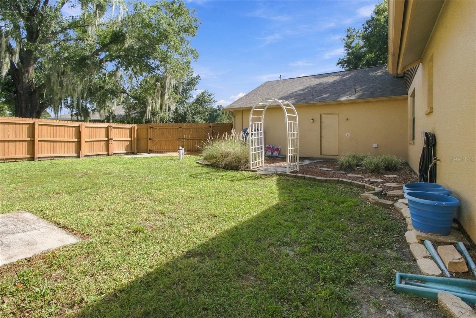 YARD FENCED WITH WOOD PRIVACY FENCE - 3180 LAKE SAXON DR, LAND O LAKES