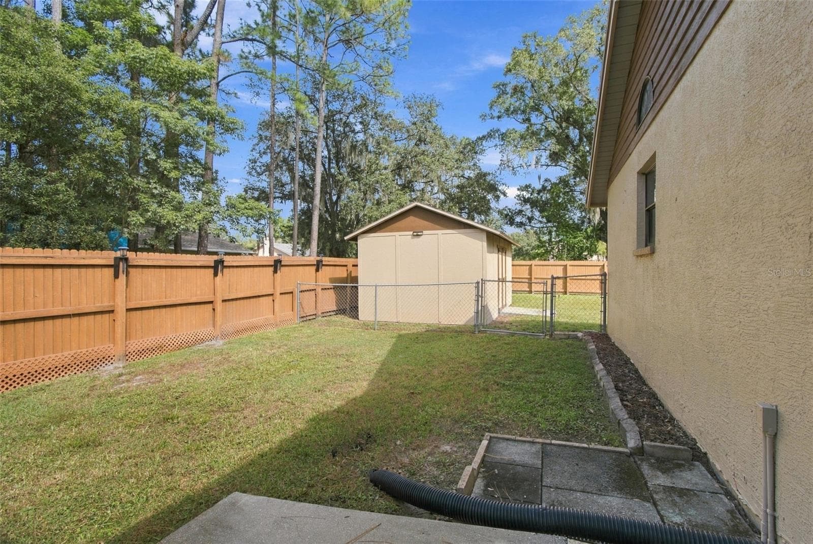 PARTIALLY FENCED WITH CHAIN LINK FENCINF FOR YOUR FURRY FRIEND - 3180 LAKE SAXON DR, LAND O LAKES