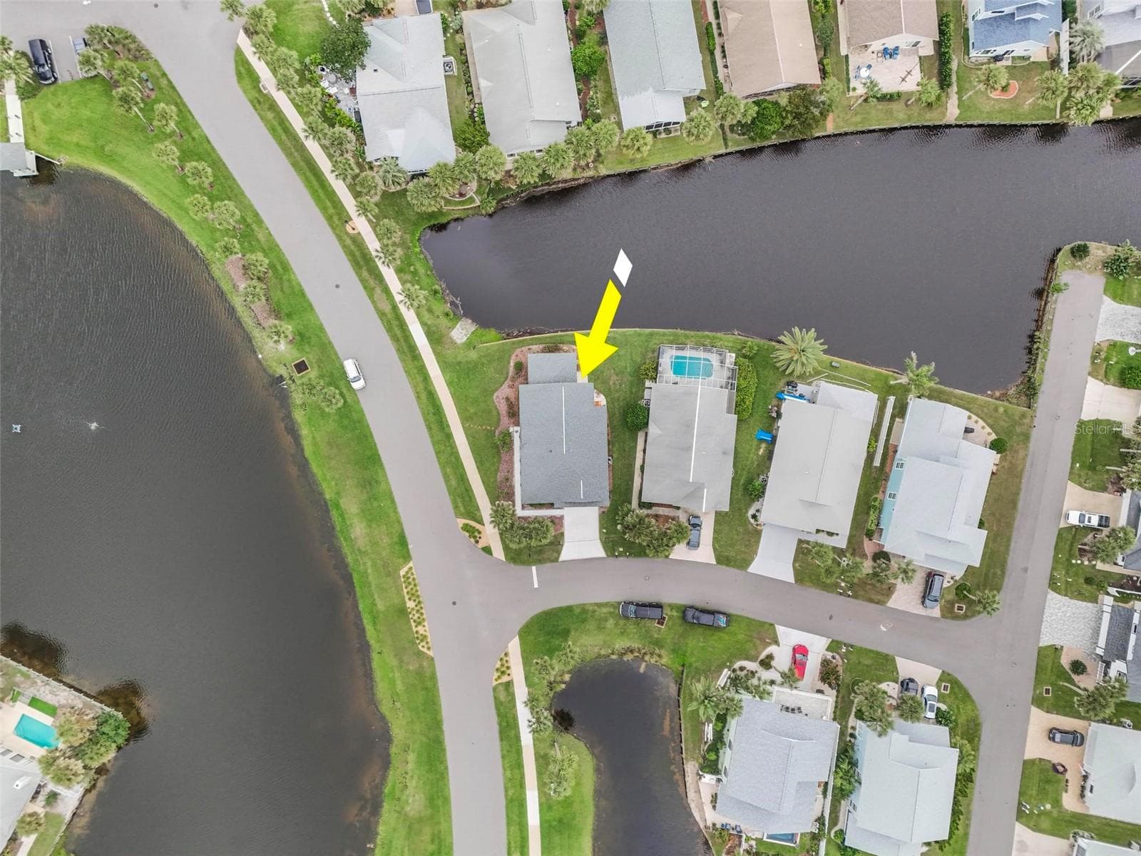 View of lake across the street and canal in front canal in back steps to ocean - 50 MEDFORD DR, PALM COAST