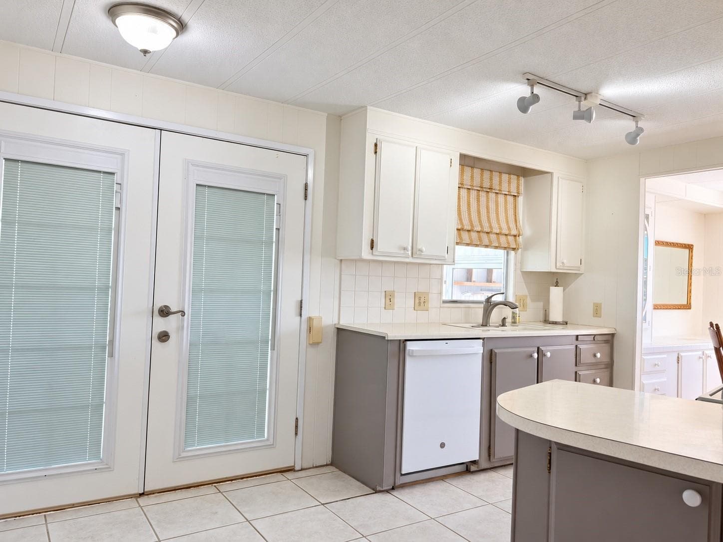 Kitchen with French entry doors - 808 53RD AVE E #35, BRADENTON