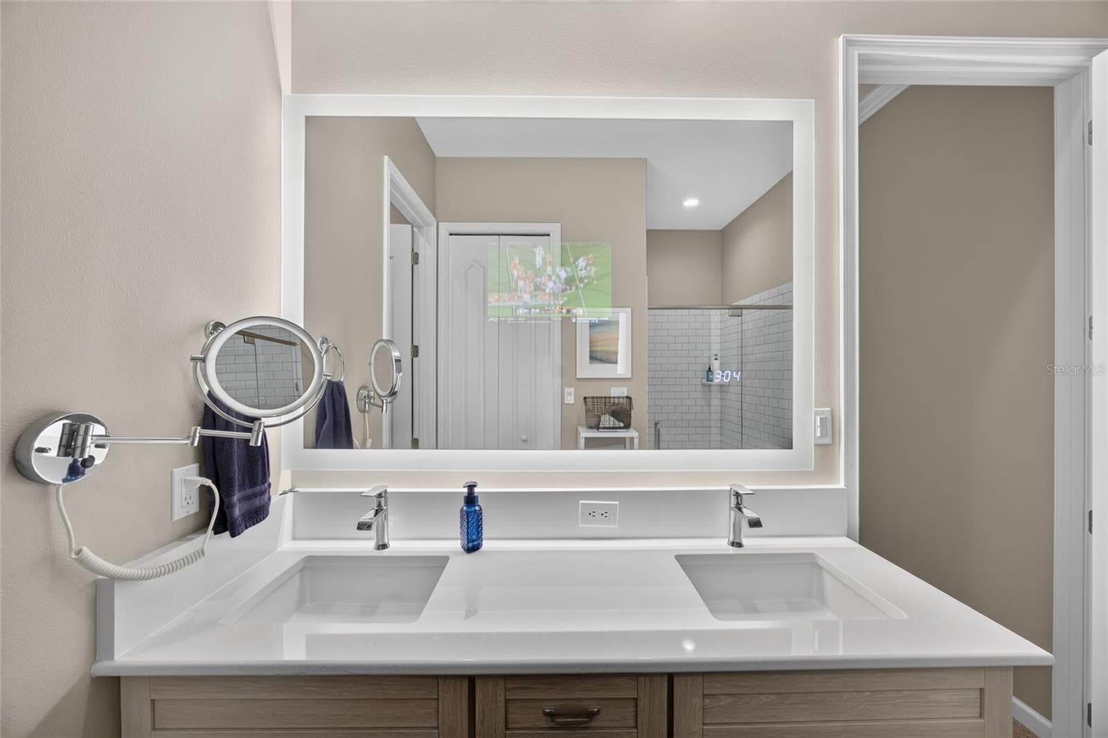 Seura Lighted Mirror includes TV. - 417 SE 10TH ST, OCALA