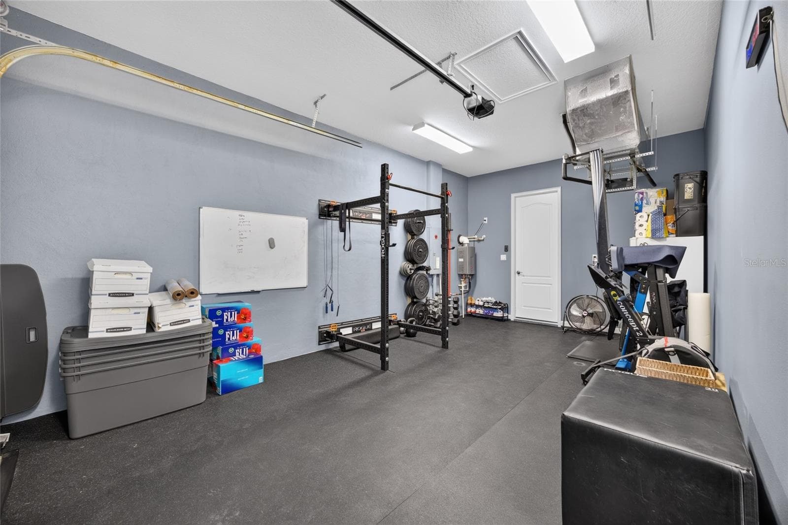 Gym equipment folds away for vehicle parking. - 417 SE 10TH ST, OCALA