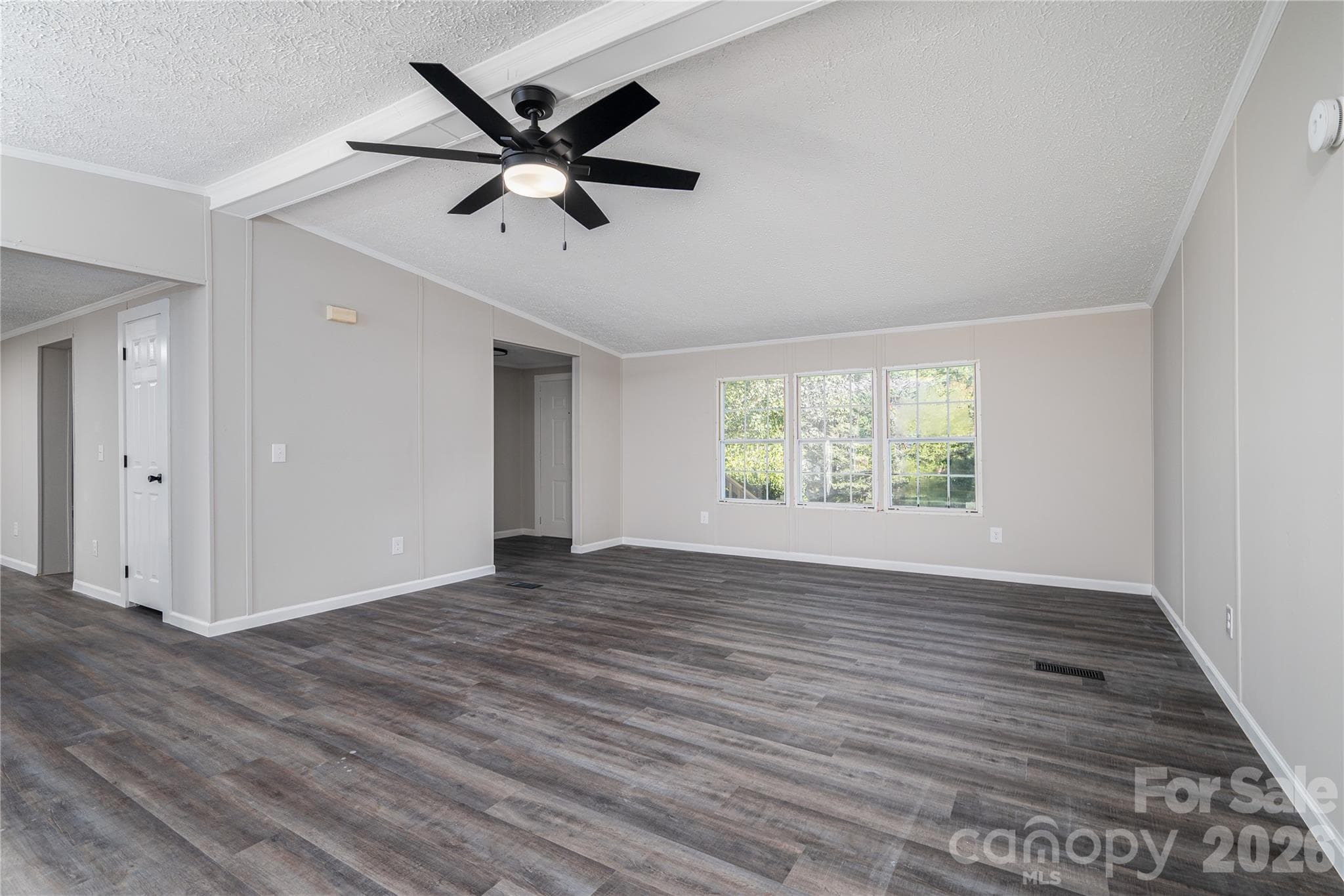 Plenty of natural light in the living room.  View from fireplace side. - 5047 Longbow Pointe, Kings Mountain