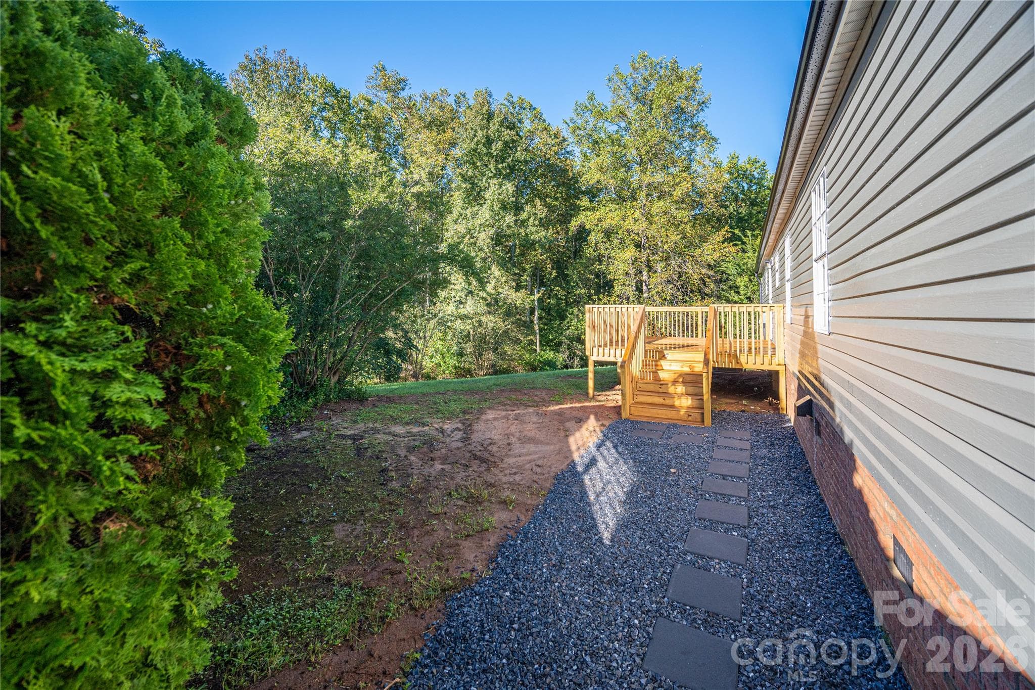 Stepping stones already in place to the back deck from the driveway - 5047 Longbow Pointe, Kings Mountain