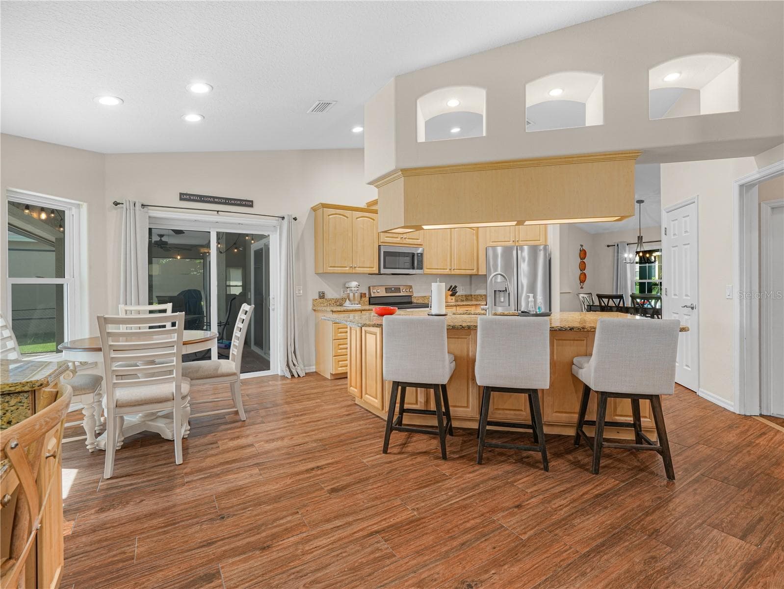 View of kitchen from Family Room - 5868 HIGH RIDGE LOOP, LAKELAND