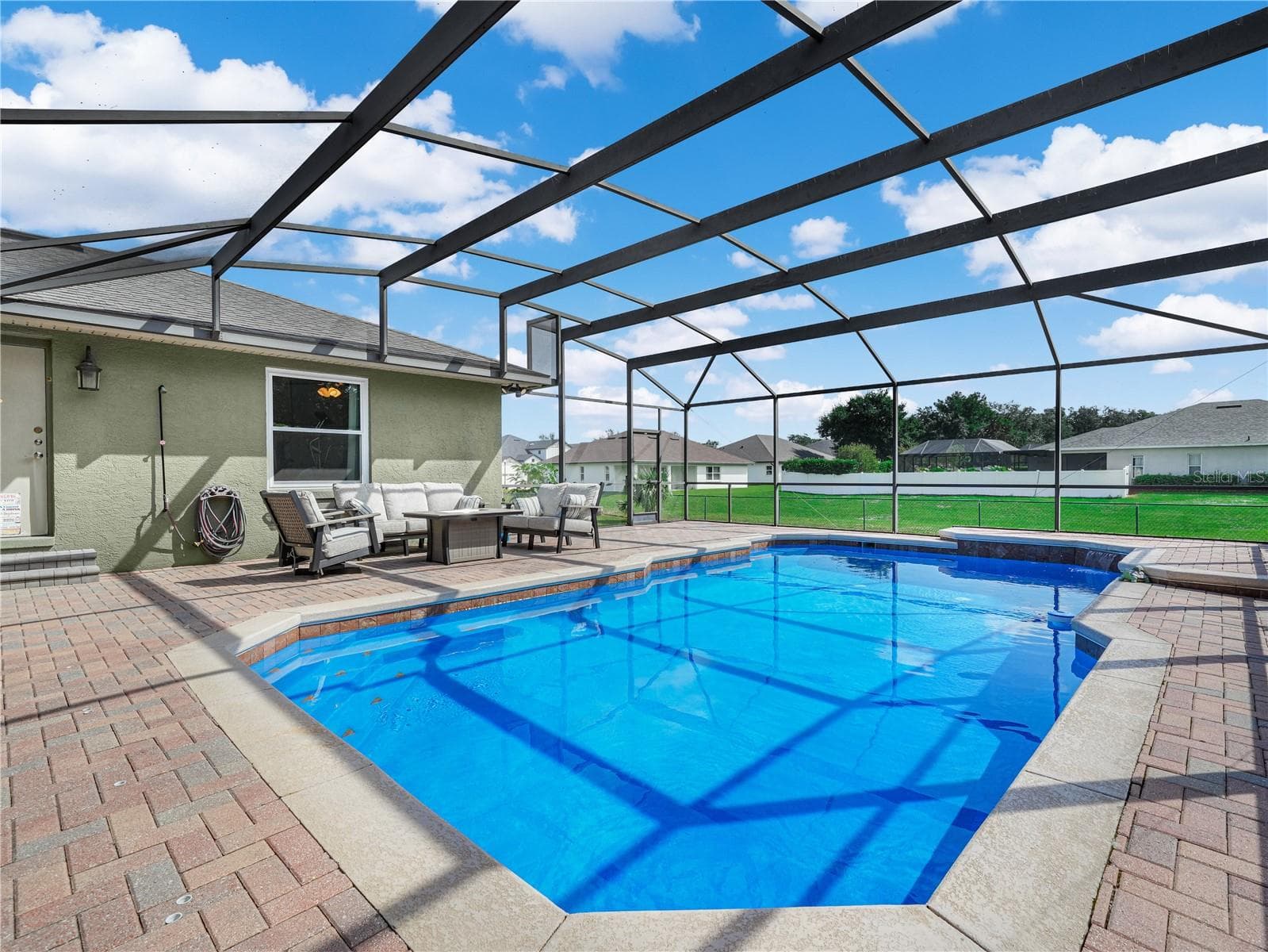 The pool with newer screen over looking the large back yard. - 5868 HIGH RIDGE LOOP, LAKELAND